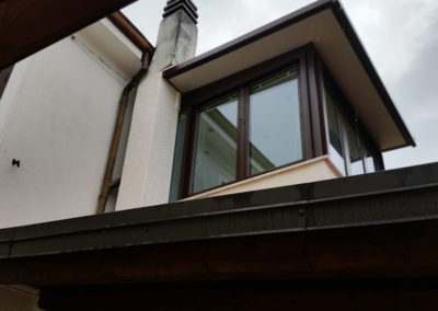 Trieste verandina alluminio taglio termico effetto legno per abitazione privata
